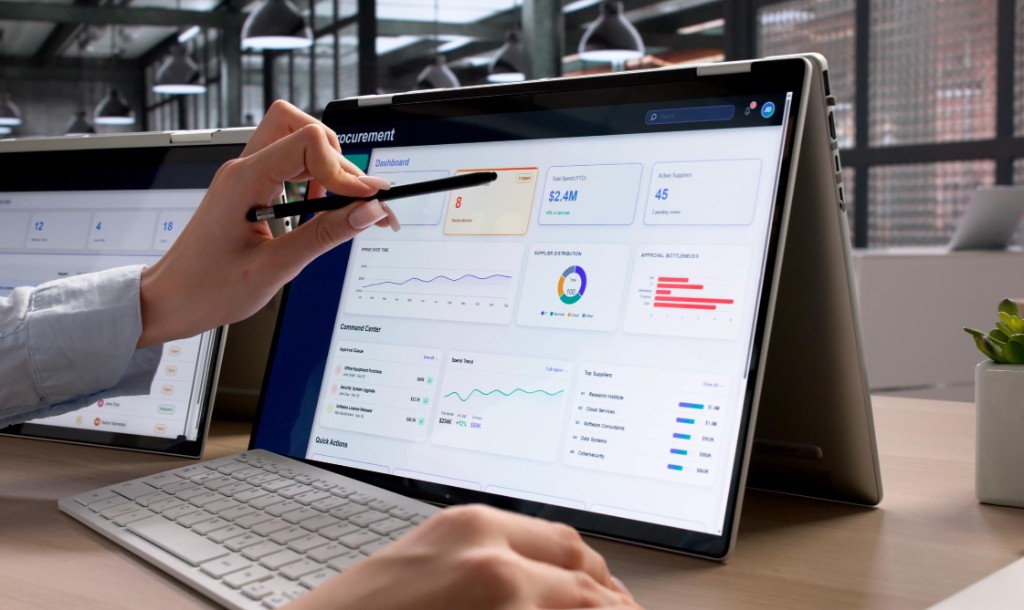 Procurement professional reviewing governance dashboards and approval controls on a laptop